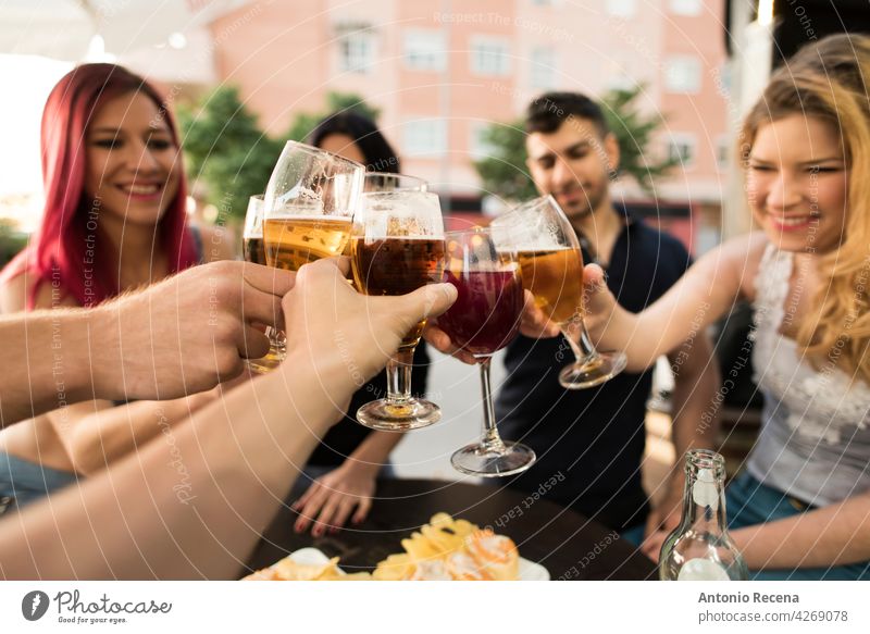 Group of friends making a toast with alcoholic drinks woman young attractive 20s joy people person youth urban women pretty pretty people outdoors city group