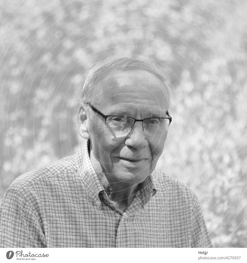 black and white portrait of friendly senior with glasses in nature Human being Man Senior citizen age masculine more adult Mature Old Retirement Smiling out