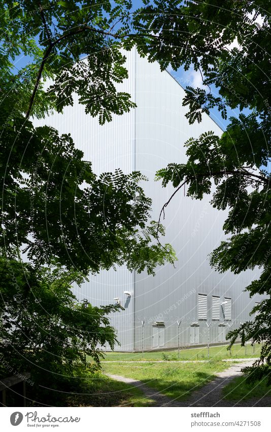 Aluminum factory building in the forest Forest trees Silhouette Fence Meadow Barbed wire Barbed wire fence Aluminium Aluminium facade Surveillance camera