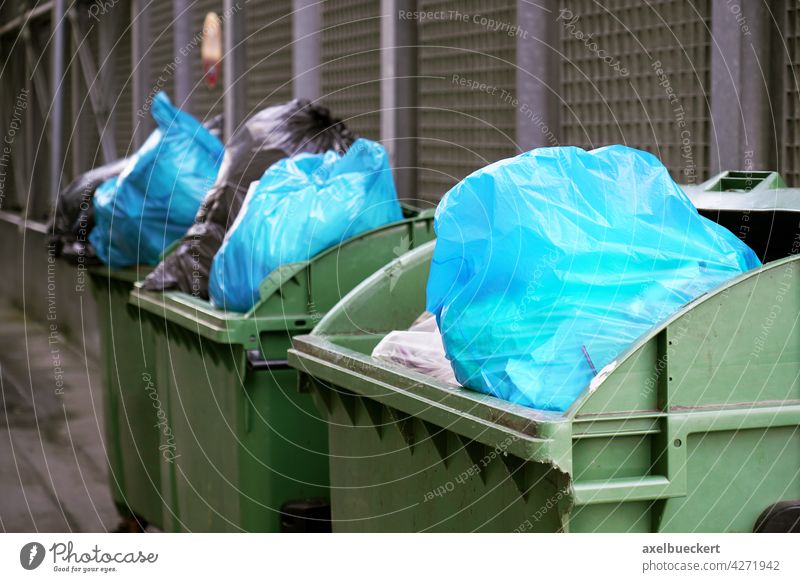 overfull garbage containers with garbage bags dustbin Garbage bag Trash Refuse disposal Trash container Waste management refuse sacks Environmental pollution