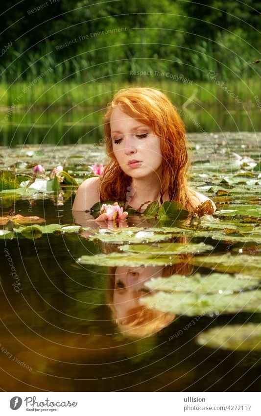 Delicate Young Sexy Red Haired Woman Enjoys Sensually Seductive Sensual In The Water Pond On A 