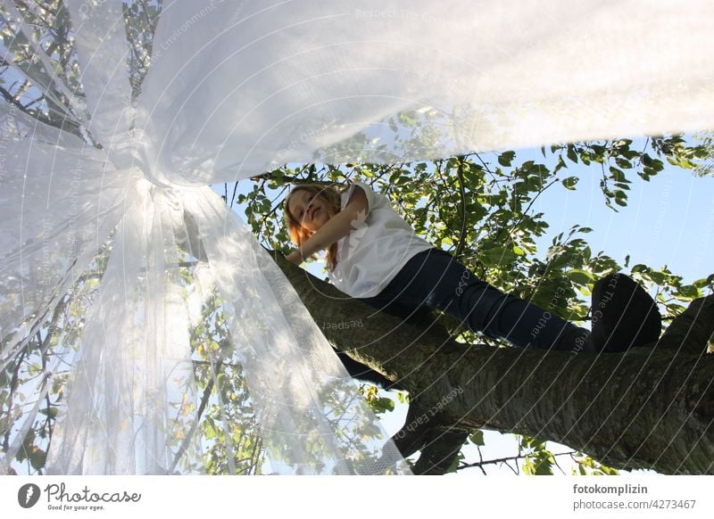 Teen girl climbing in a tall tree with a mosquito net hanging in it Mosquito net Girl Youth (Young adults) Feminine Young woman teenager Tree Climbing Net
