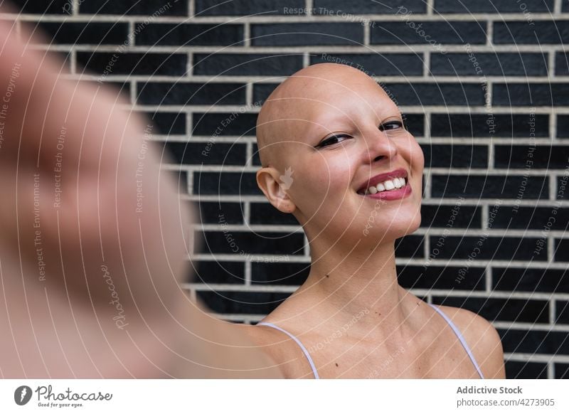bald woman facing right