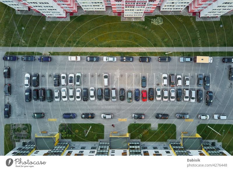 Aerial view of car parking lot near modern house building residential yard transport living sector parking space vehicle outdoor top asphalt street urban vacant