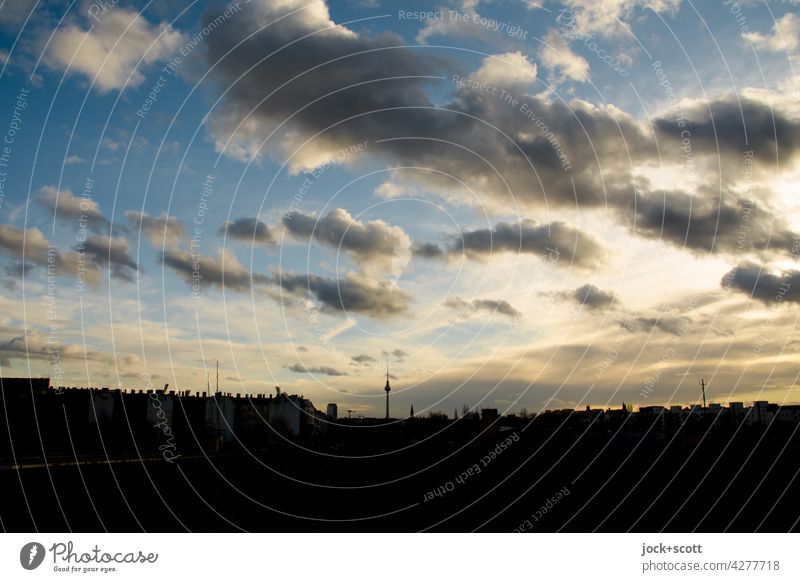 Evening sky with clouds over a big city Berlin Sky Clouds golden hour Sunset Nature Sunlight Silhouette Berlin TV Tower Background picture Beautiful weather