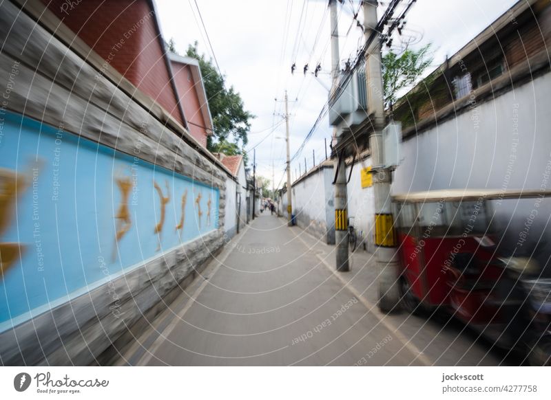 traditional narrow alley on the move Hutong Beijing China Old town Alley Narrow motion blur Lanes & trails Traffic infrastructure Style Authentic Facade