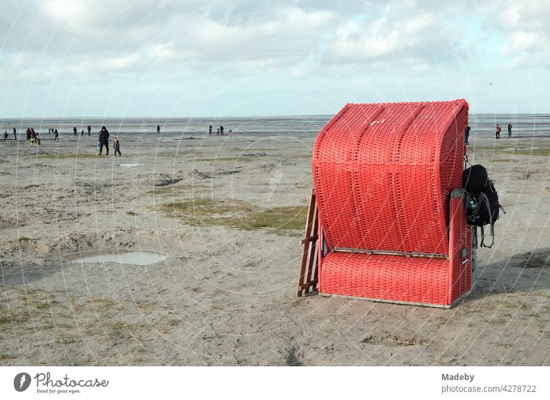 Lonely red beach chair at the beach of Bensersiel at the coast of the North Sea near Esens in East Frisia Beach Beach chair Red Autumn Sand Season