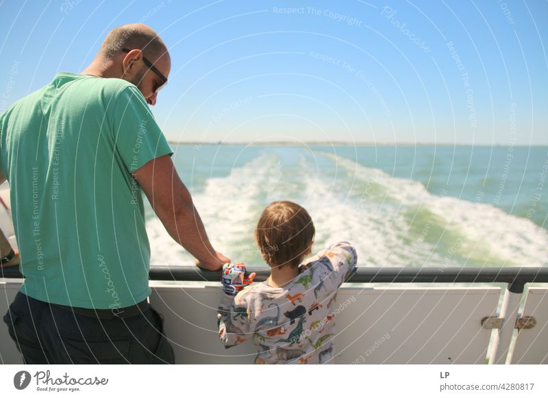 father and child looking at the water from a boat Adventurer Infancy Child portrait fortunate Happy contented Contentment Father Son Watercraft Impressive