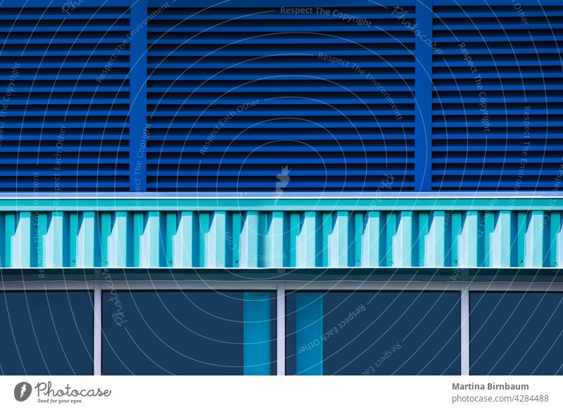 Close up of a blue bulding exterior with windows and blinds turquiose summer structure background technology abstract business architecture modern futuristic