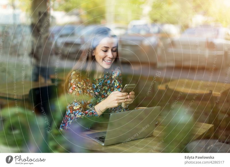 Woman with laptop in cafe people woman young adult casual attractive female smiling happy Caucasian toothy enjoying one person beautiful portrait positivity