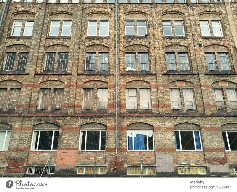 Classic old brick building with curtained windows in the district of Bockenheim in Frankfurt am Main in Hesse Old building Facade clinker Brick