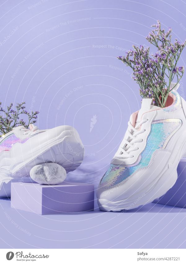 White female sneakers with sequins with flowers inside on purple background with geometric cube podium footwear shoe fashion woman walk urban nature design run