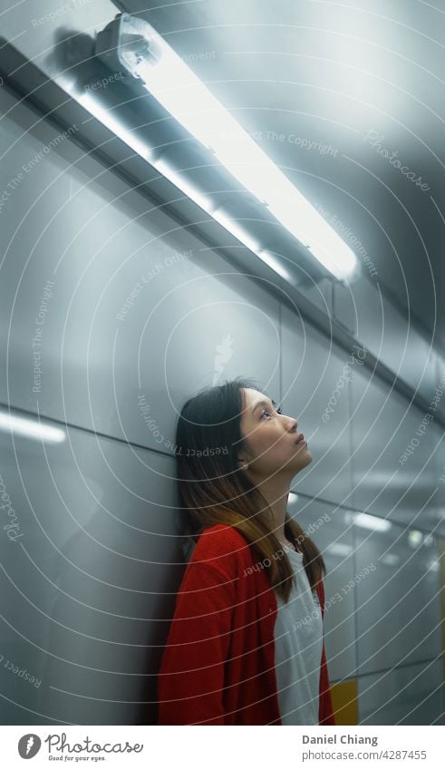 The Girl Thinking In The Subway alone Adults lonely lonelyness sad mood woman depression young mental unhappy thoughtful reflection sadness subway Red Looking