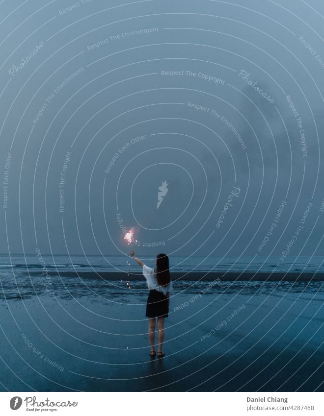 Before Sky Turn Dark Beach Blue Blue sky mood Moody fireworks night Evening Dusk Landscape lonely Woman Dress Coast Ocean To enjoy Long-haired evening light