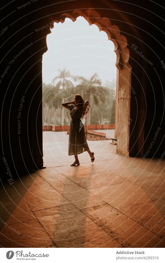 Woman standing at entrance of Tomb of Safdar Jang woman tourist sightseeing old destination mausoleum attract heritage medieval historic female tourism travel