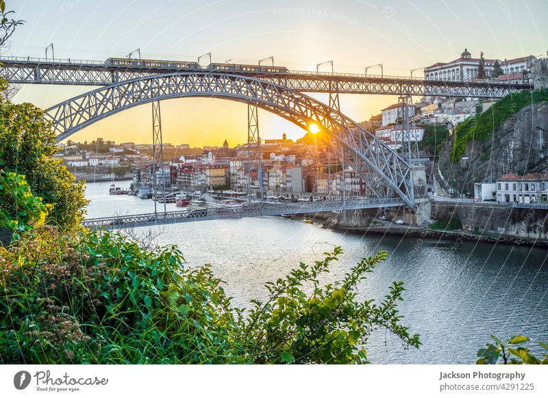 Cityscape of Porto with Douro river and famous bridge by sunset, Portugal porto portugal douro arch dom luis picturesque riverbank luis bridge outdoor