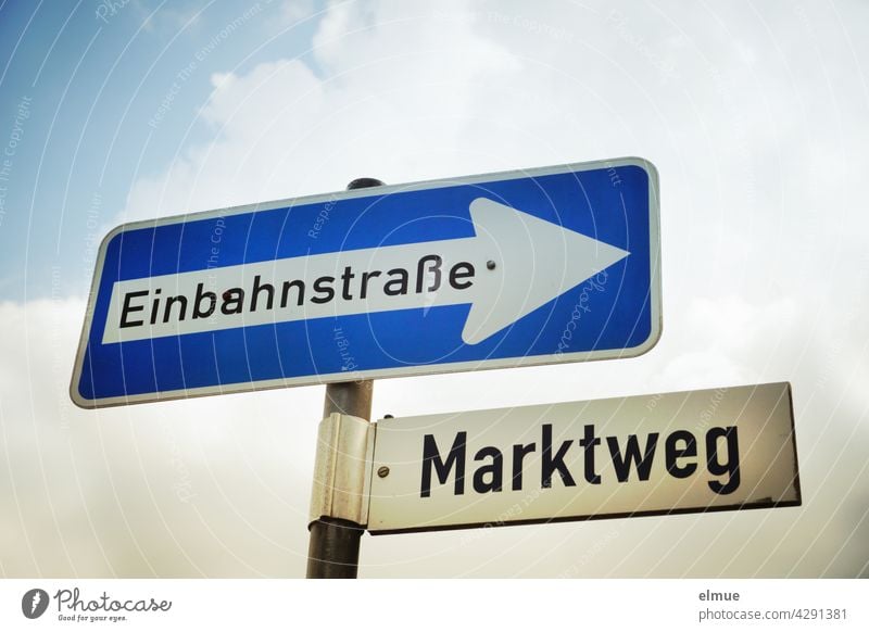 Traffic sign " One-way street " and street sign " Marktweg " fixed at a metal bar / Orientation / VZ 220-20 Road sign prescribed direction Market Street