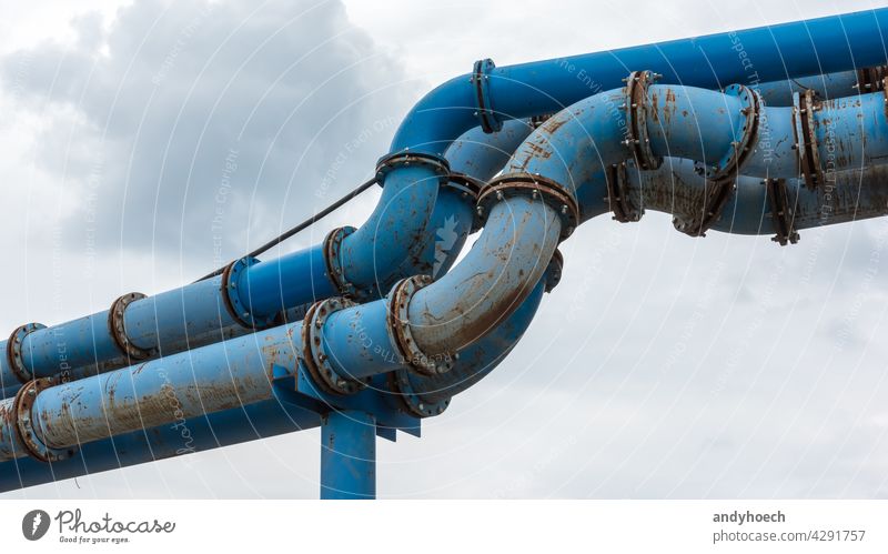 Composite of blue water pipes on a construction site Business cloud connection copy space drain drainage engineer engineering equipment fitting fix industrial