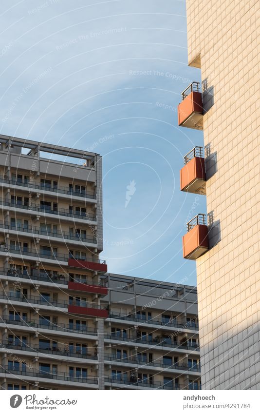 Three balconies on the sunny side of an apartment building anonymity apartments architecture bad luck balcony balcony home bliss block building exterior chance