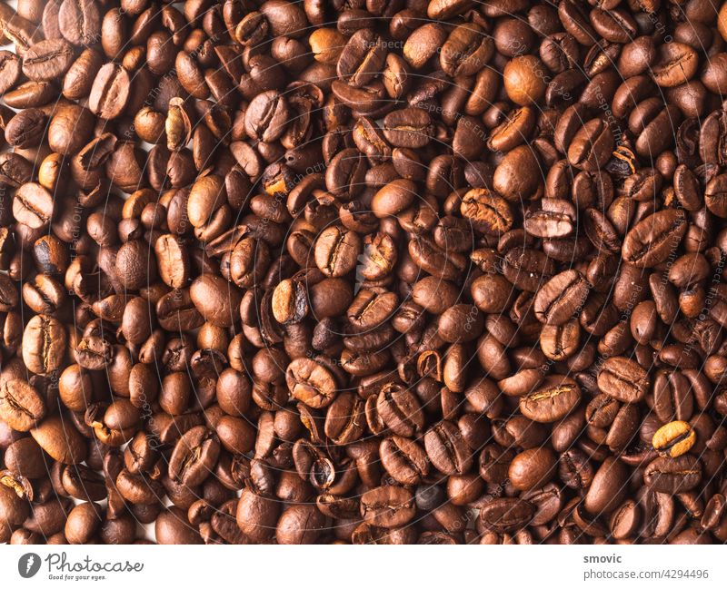 Aromatic roasted coffe beans for background brown coffee black caffeine drink espresso natural white breakfast coffee beans dark table cafe closeup cup morning
