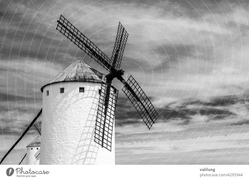 Traditional Spanish windmill in Campo de Criptana, Castilla La Mancha, Spain, on the famous Don Quixote Route; black and white image Cervantes Ciudad Real