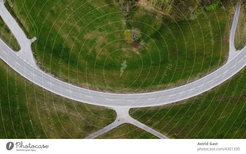 Aerial view with a drone of a road curve and different lanes in the Allgäu (Bavaria, Germany) Aerial photograph drone photo Street off Curve curvy streets ways