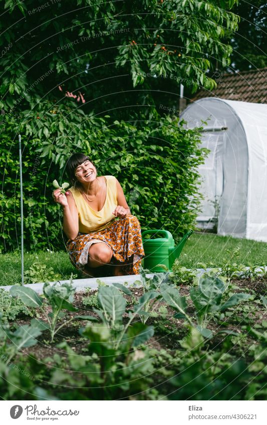 Woman sits in the garden in front of a vegetable patch and is happy about a self-harvested radish Garden Garden Bed (Horticulture) Radish reap Gardening