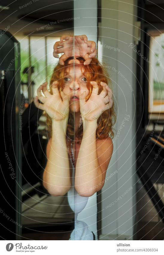Portrait and hands of scary redhead woman, face reflection in mirror, female duality, mental disorder, subconscious crisis portrait creepy fear concept ghost