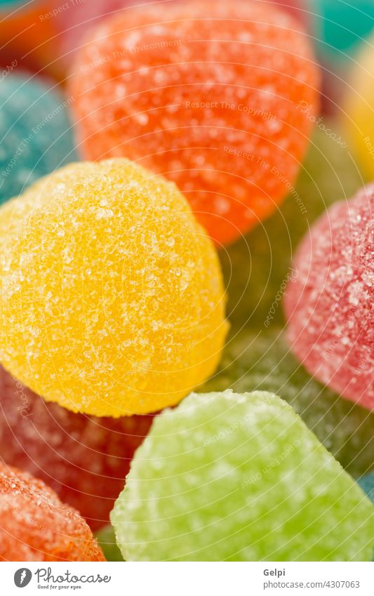 Colorful jellybeans to use wallpaper sweet sugar candy orange food close up green confection background colorful yellow festive confectionery dessert unhealthy