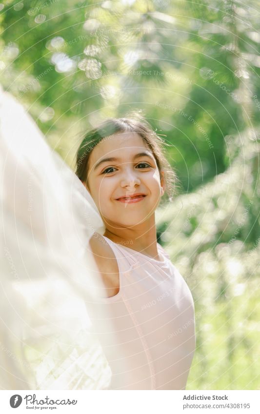 Delighted ballerina playing in summer park girl playful teenage ballet dancer happy meadow dress joy pointe shoe nature cheerful freedom carefree harmony