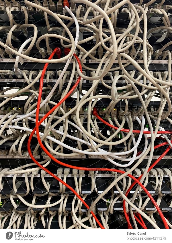 Internet cables rack not arranged on data center connection core fiber technology telecom room information digital router switch hosting industry patch