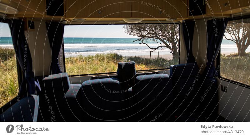 Looking through the window of a camper van rv destination drive journey trip vacations motorhome car transport camping campervan New Zealand daytime oceania