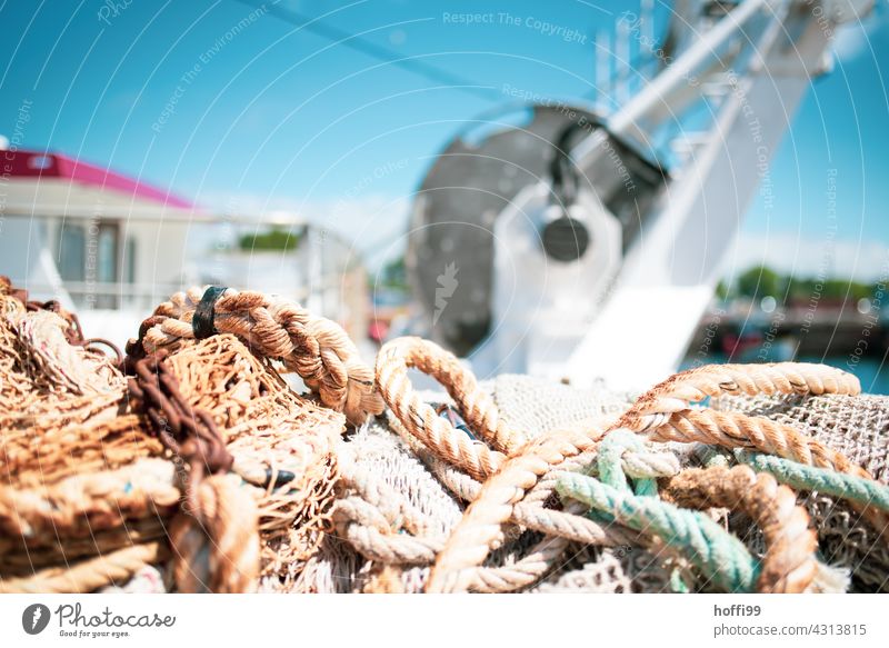 Ropes and rigging on board a fishing boat in bright sunshine ropes Rigging Fishing boat Net Fishing net Fisherman Ocean Fishery Harbour Fishing (Angle)