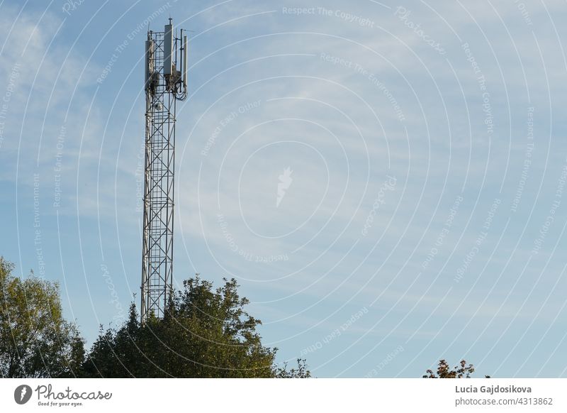 Base Transceiver Station in city Martin in Slovakia. The station is located on a tall metal tower-like construction. An example of modern technology supporting cellular network in 4G quality.