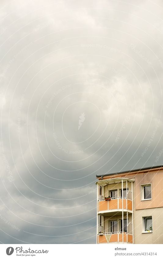 corner of an apartment building with balconies in front of overcast sky / my home is my castle / vacation on balcony Apartment Building Apartment house Balcony