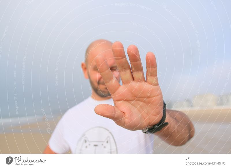 man showing palm at the camera Emotions Tolerant Acceptance Peace solidarity Lovely multiethnic cooperation anti racism two unity interracial