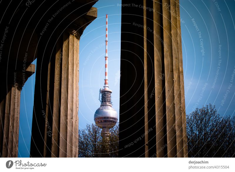 Between the columns , the Berlin television tower. Tower Landmark Sky Architecture Town Capital city Manmade structures Germany Alexanderplatz Building Deserted