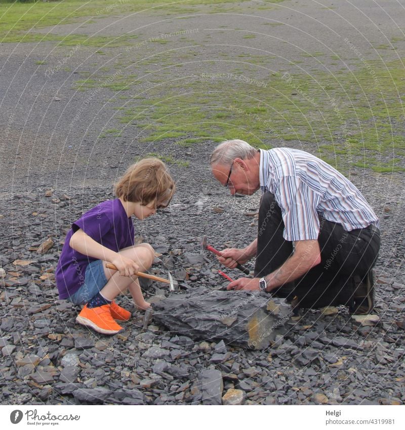 in search of fossils - grandpa and grandson search for fossils in the Piesberg quarry near Osnabrück Fossil Fossil Search Grandfather Human being Man Child