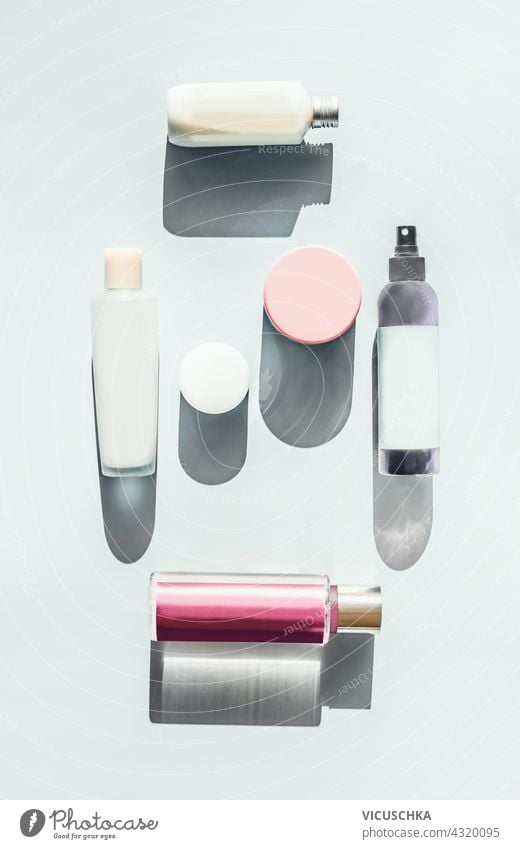 Set of cosmetics for skin care. Lots of cosmetic products, bottles and jars on a light background in sunlight. Top view. Beauty flat lay. Mock up branding set