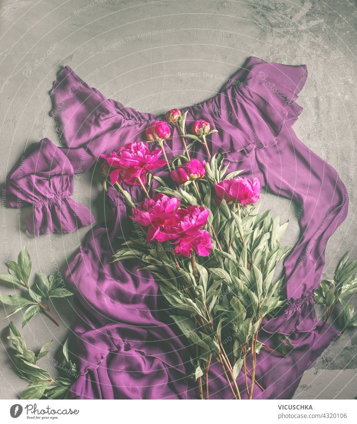 Purple flounced dress with peonies flowers bunch . Fashion and beauty flat lay. Copy space . Top view purple fashion copy space top view floral flatlay peony