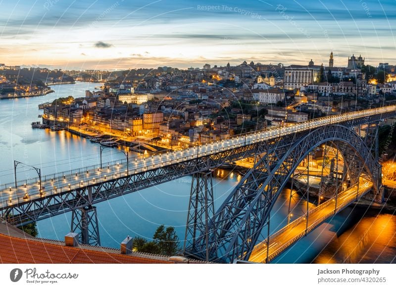 Skyline of the historic city of Porto with famous bridge at night, Portugal porto portugal light illuminated architecture attraction beautiful boats building