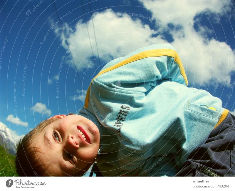 The sky above me Child Clouds Gymnastics Hiking Portrait photograph Leisure and hobbies Small Human being Joy Playing Sky fun Nature Funny Laughter