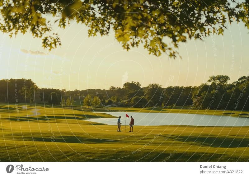 Sunset Time On The Golf Course Golf course Friendship friend talk Golfer Playing Green Exterior shot Dawn golden golden hour Sunrise joy enjoy fun friends tiny