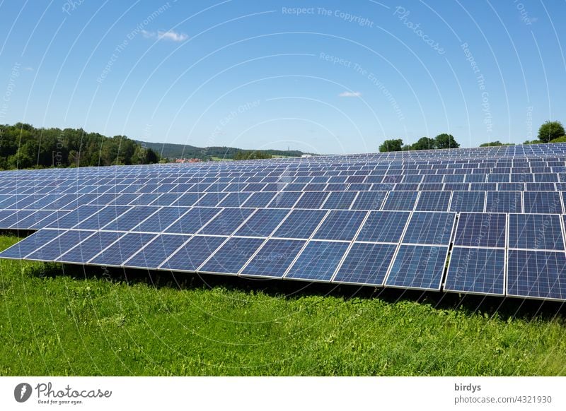 Large ground-mounted photovoltaic system in a rural area. Solar energy, regenerative solar park photovoltaics Solar Energy regenerative energy Blue sky