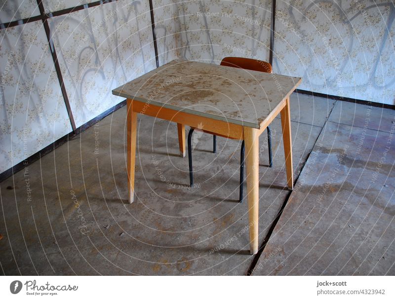 bent room with table + chair Room sample wallpaper Wooden table Chair slanting Undulating frowzy lost places Interior design Ravages of time Decline Change