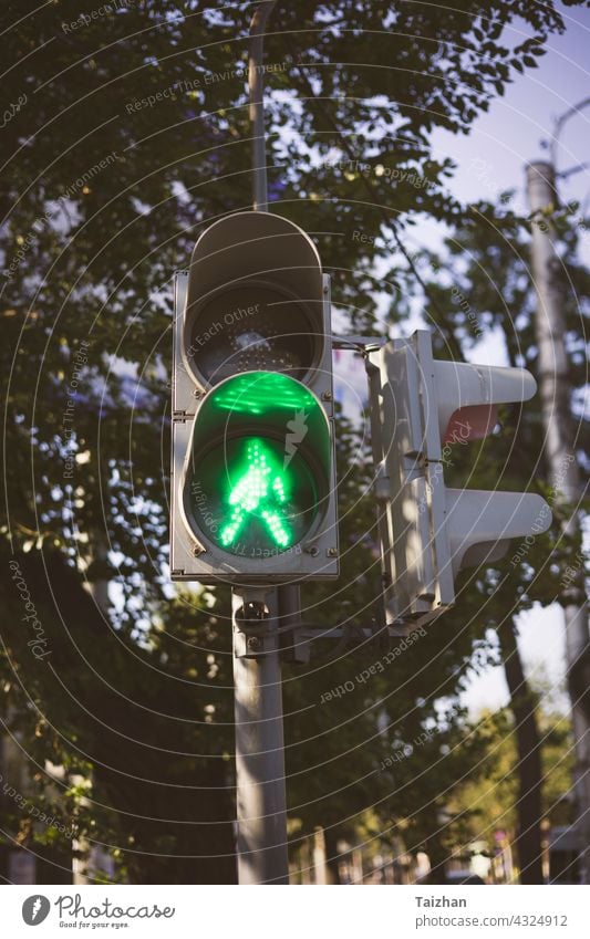 traffic light with green arrow light up in city . close up stoplight control lamp signal go urban color road symbol street direction driving headlight image law