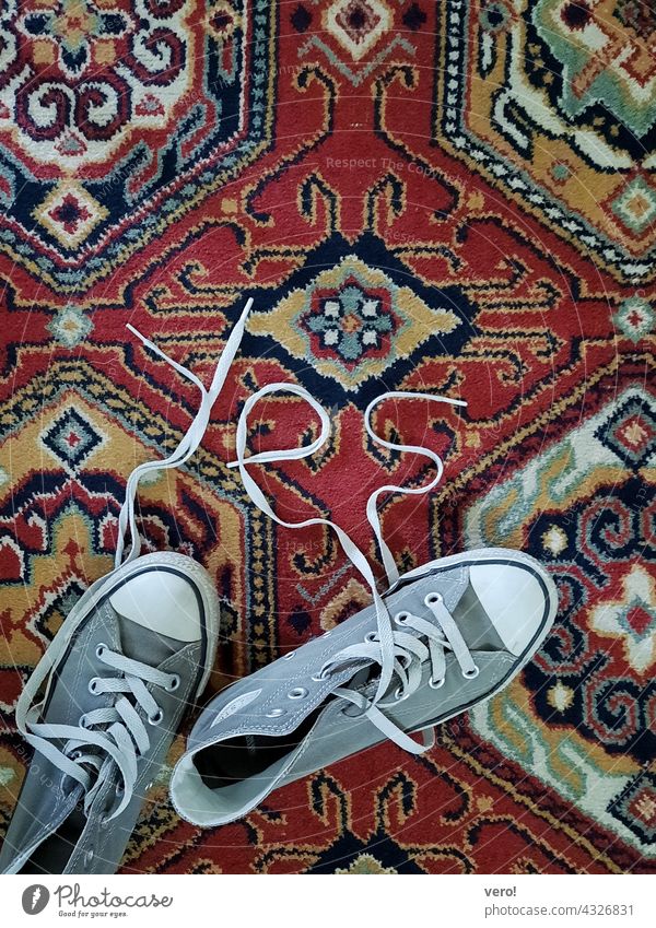 YES, shoes, carpet Bird's-eye view Colour photo Deserted Interior shot teen urban Athletic shoelaces Retro Trite worn-out Kickers Footwear sneakers Chucks Red
