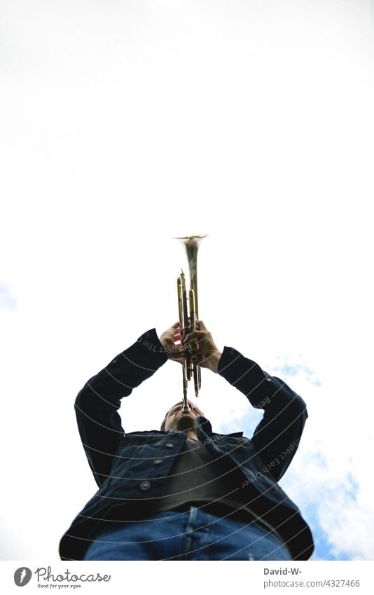 Trumpeter - playing signal with the trumpet - a Royalty Free Stock Photo  from Photocase