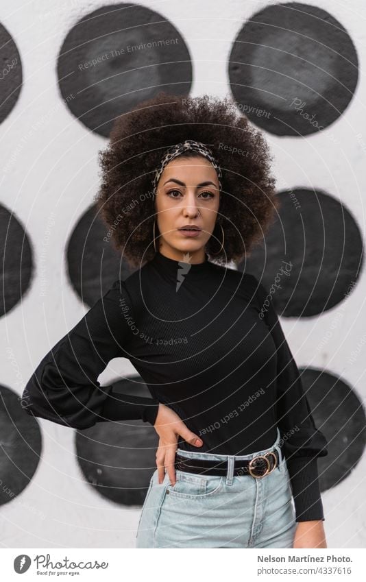 Portrait of young pretty yoga girl with short curly hair in sportwear. Calm  and peace on her face. Slight smile Stock Photo - Alamy