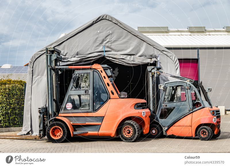 Two Forklift loader packaging industry forklift warehouse transportation freight storage distribution vehicle cargo stacking shipping equipment industrial